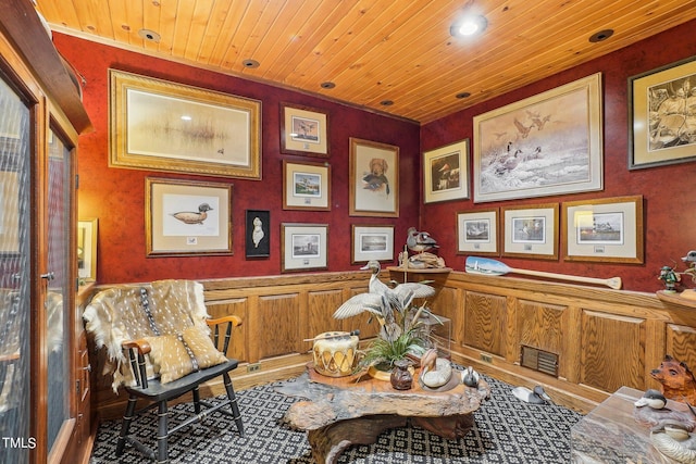 living area featuring wood ceiling