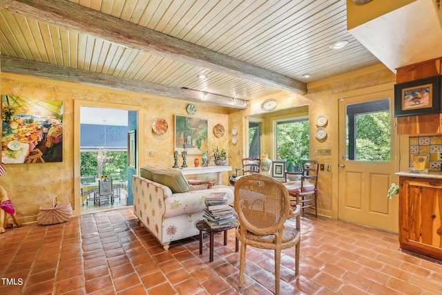 living room with beam ceiling and wood ceiling