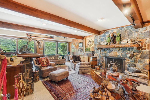 living room featuring a fireplace and beamed ceiling