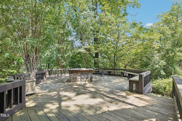 wooden terrace featuring a bar