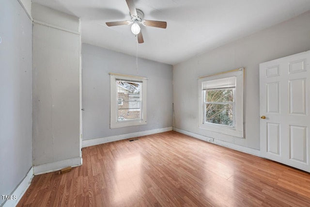 unfurnished room featuring ceiling fan and light hardwood / wood-style flooring