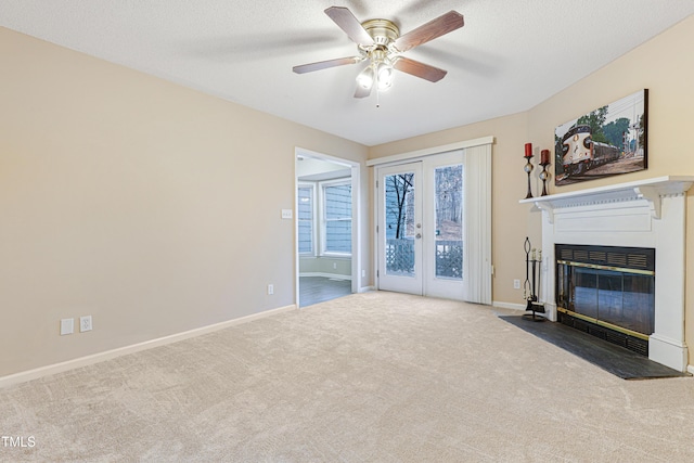 living room with ceiling fan, french doors, a textured ceiling, and carpet flooring