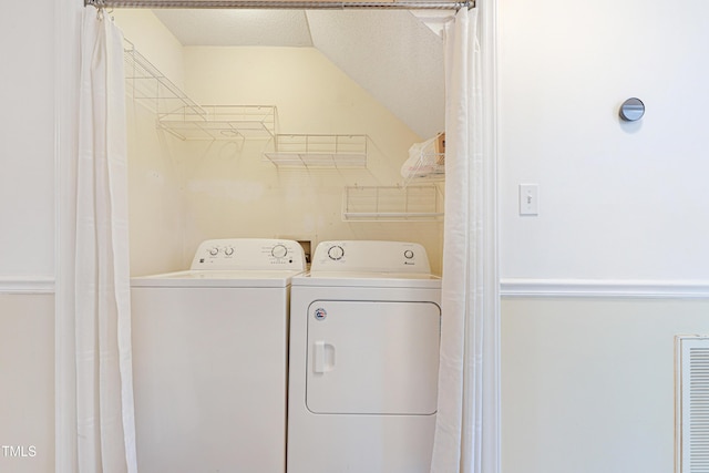 washroom with washing machine and dryer