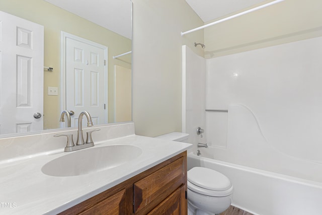 full bathroom with vanity, bathtub / shower combination, and toilet