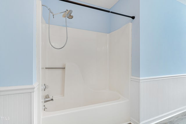 bathroom featuring bathtub / shower combination and a textured ceiling