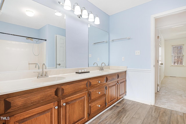 bathroom with vanity and hardwood / wood-style floors