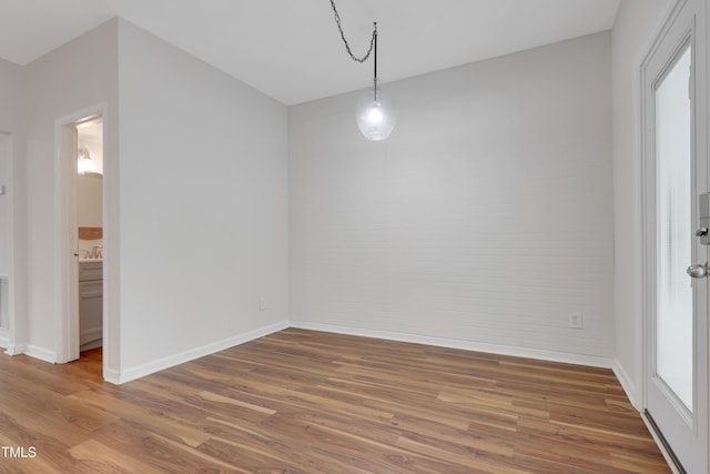 unfurnished dining area with wood-type flooring