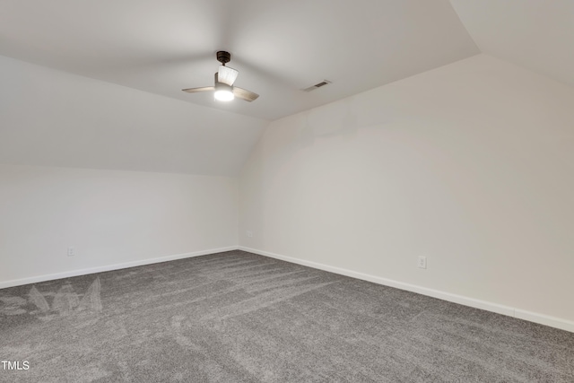 additional living space with vaulted ceiling, carpet floors, and ceiling fan