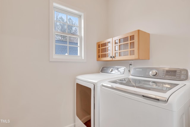 laundry area with washing machine and dryer