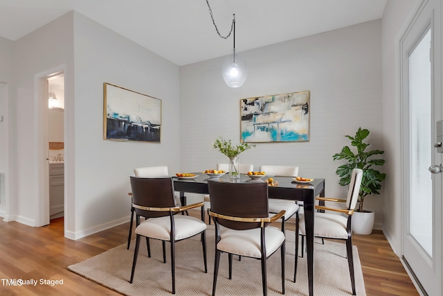 dining area with hardwood / wood-style flooring and a wealth of natural light