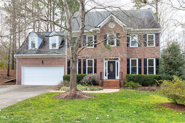 colonial house with a garage and a front lawn