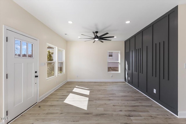 entrance foyer featuring ceiling fan and light wood-type flooring