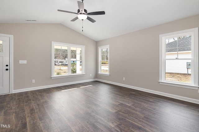 empty room featuring ceiling fan, dark hardwood / wood-style floors, and vaulted ceiling