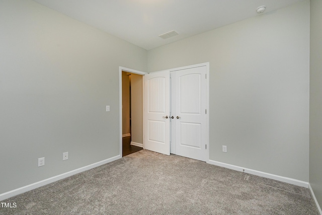 unfurnished bedroom featuring carpet flooring