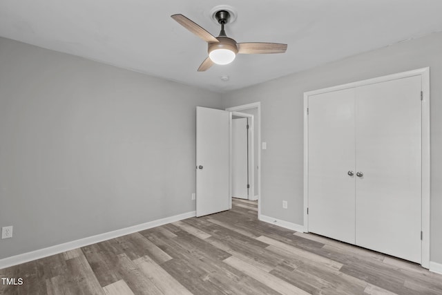 unfurnished bedroom featuring a closet, ceiling fan, and light hardwood / wood-style floors