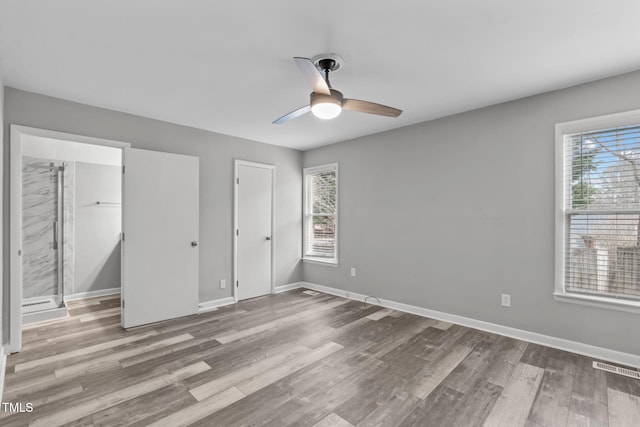 unfurnished bedroom featuring ceiling fan and wood-type flooring