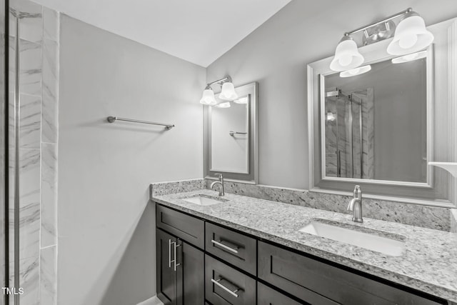 bathroom with vanity and an enclosed shower