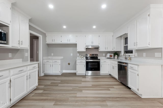 kitchen with sink, white cabinets, stainless steel appliances, crown molding, and light wood-type flooring