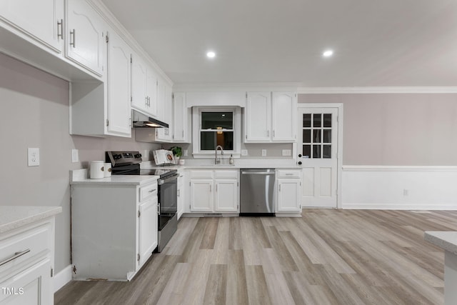 kitchen featuring sink, crown molding, stainless steel appliances, white cabinets, and light wood-type flooring