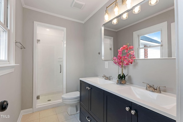 bathroom with vanity, ornamental molding, a shower with shower door, tile patterned floors, and toilet