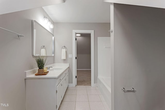 bathroom with tile patterned floors and vanity