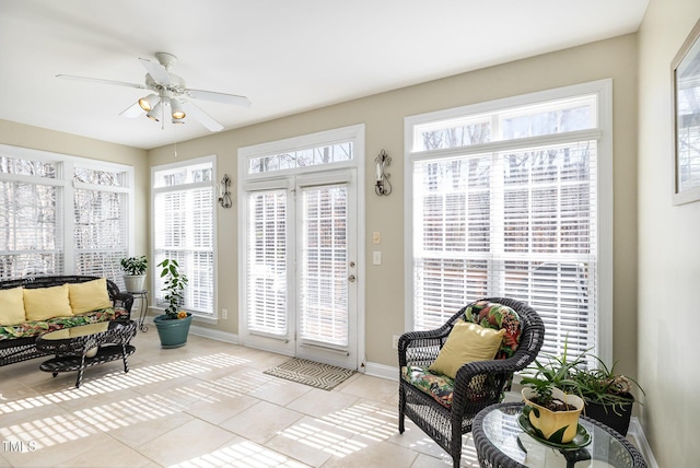 sunroom / solarium featuring ceiling fan