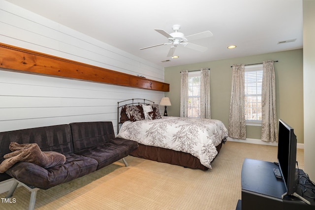 bedroom featuring light colored carpet and ceiling fan