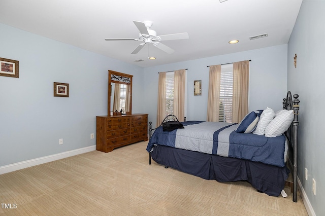 bedroom featuring ceiling fan and light carpet