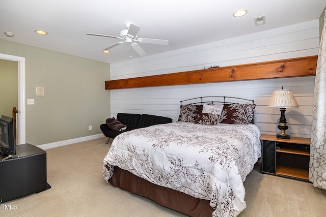 bedroom with light carpet and ceiling fan