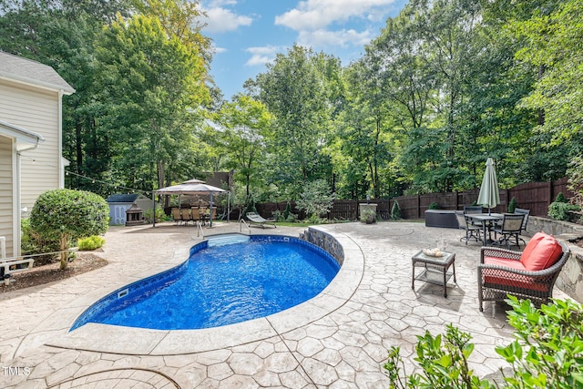 view of pool featuring a gazebo and a patio area