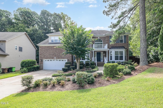 view of front facade with a front lawn, a balcony, concrete driveway, an attached garage, and brick siding