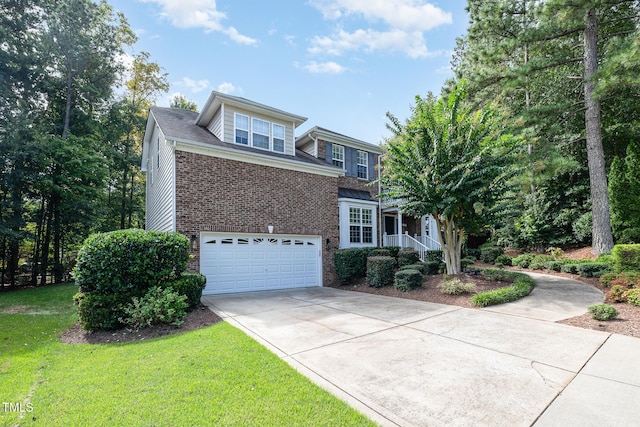 view of front of home featuring a garage and a front lawn