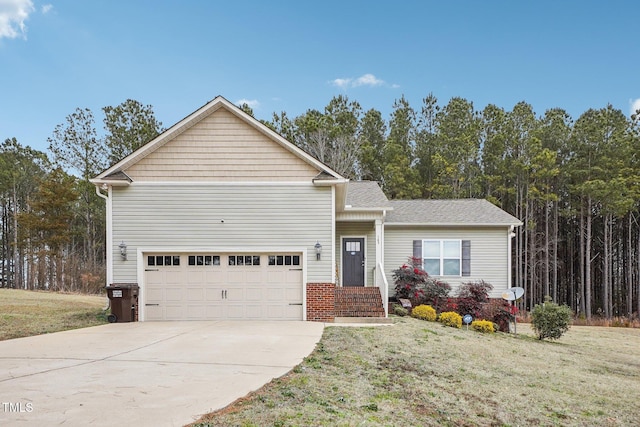 view of front of property featuring a garage and a front lawn