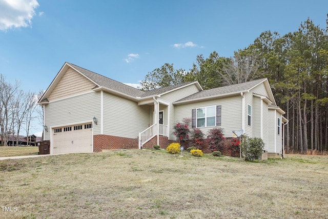 view of front of property featuring a garage and a front lawn