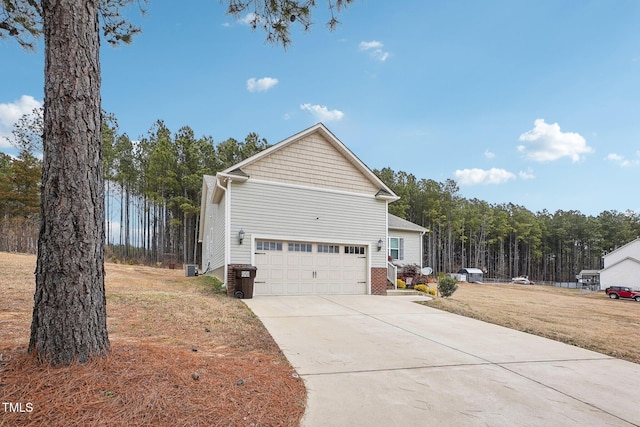 view of front of house with a garage and a front lawn