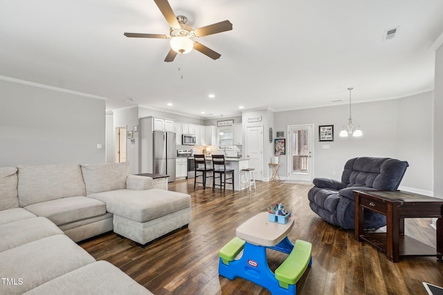 living room featuring crown molding, dark hardwood / wood-style floors, and ceiling fan with notable chandelier