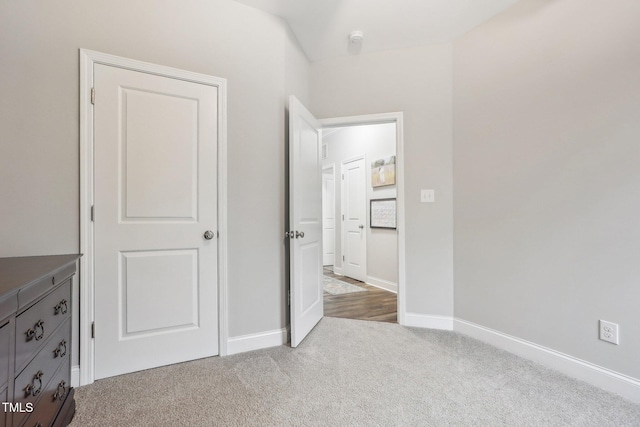 unfurnished bedroom with light carpet