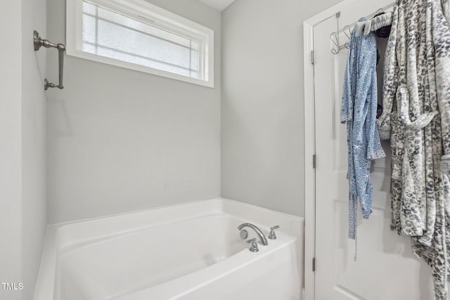 bathroom featuring a tub to relax in