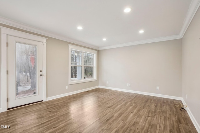 interior space featuring hardwood / wood-style floors and crown molding