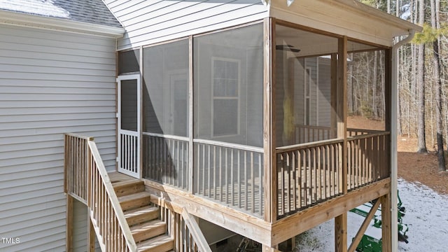 view of side of home with a sunroom