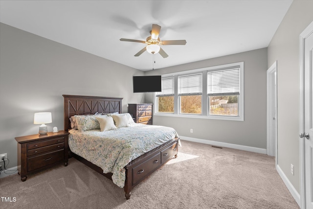 bedroom with light colored carpet and ceiling fan