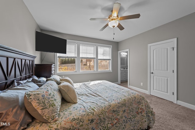 bedroom featuring carpet flooring, ceiling fan, and ensuite bath