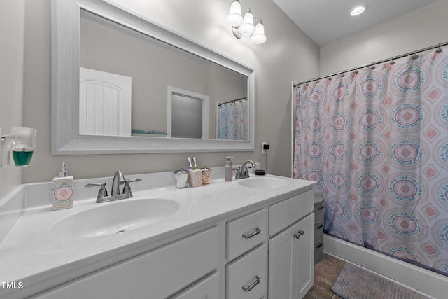 bathroom with vanity and a shower with shower curtain