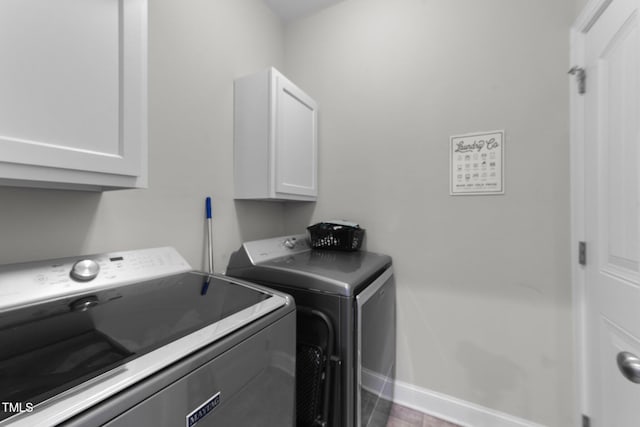 laundry area with cabinets and washer and dryer