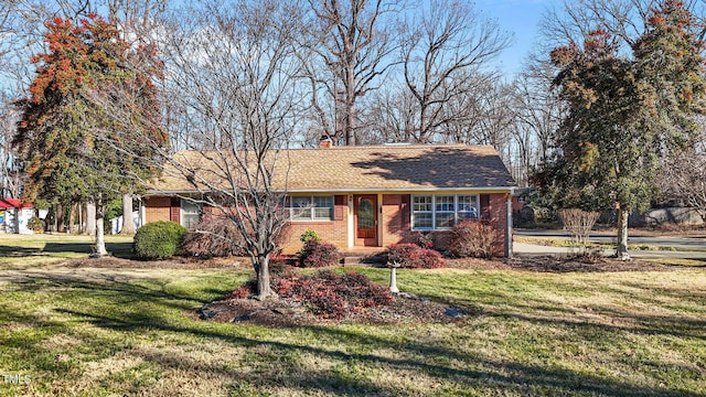 ranch-style home with a front lawn