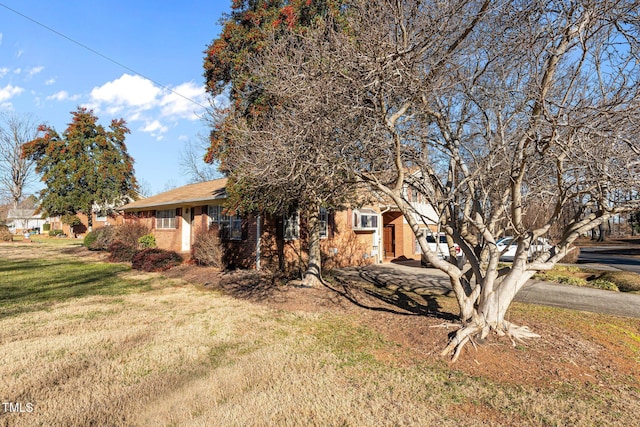 view of property exterior featuring a yard