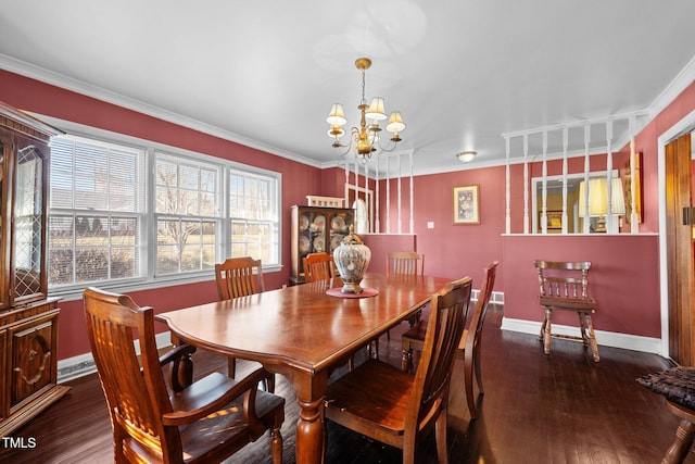 dining room featuring ornamental molding, dark hardwood / wood-style floors, and a chandelier