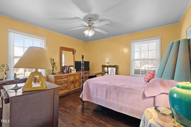 bedroom with ceiling fan and dark hardwood / wood-style flooring