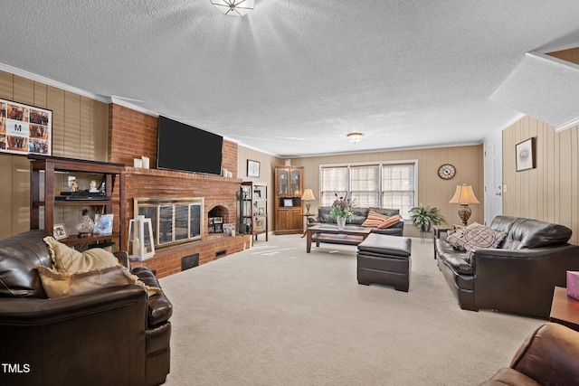 carpeted living room featuring crown molding, a textured ceiling, and a fireplace