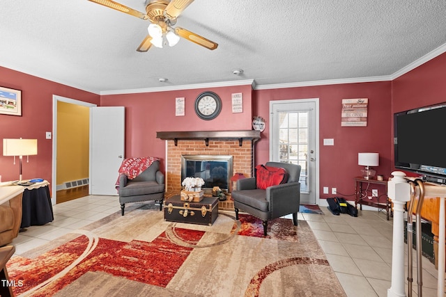 living room with crown molding, a brick fireplace, light tile patterned floors, and a textured ceiling